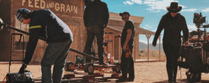 A film crew working with ram board being used on set