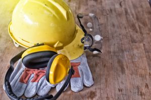 Hard hat and gloves on the floor