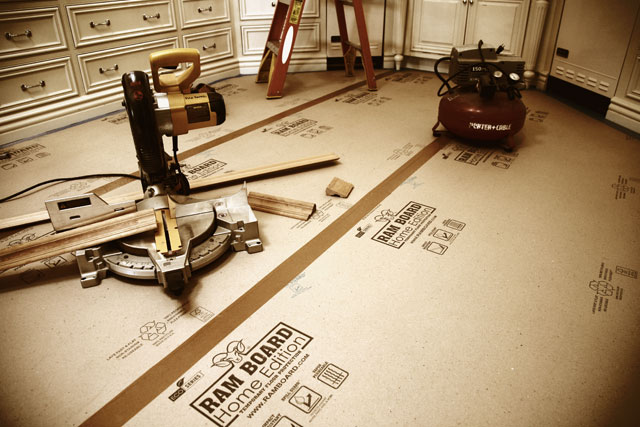 Ram Board lining the floor in a kitchen
