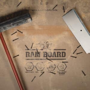 ram board heavy duty surface protection with saw dust, broom, and loose screws