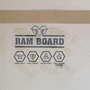 water beading up on spill resistant ram board paperboard protection