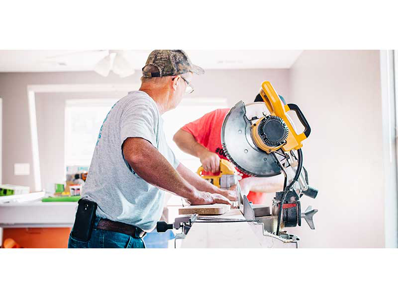 Man with saw on DIY project