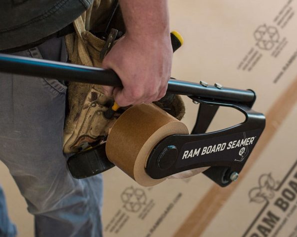 worker holding seamer