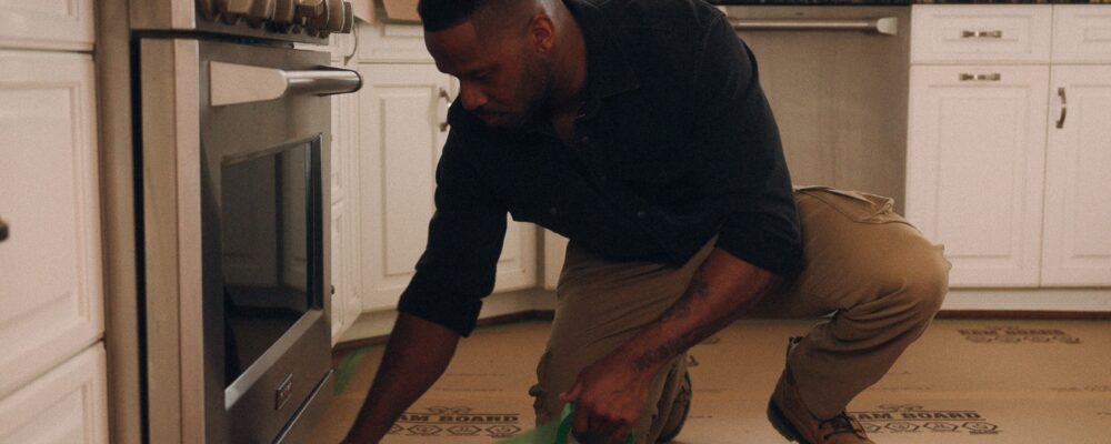 contractor installing ram board in a kitchen